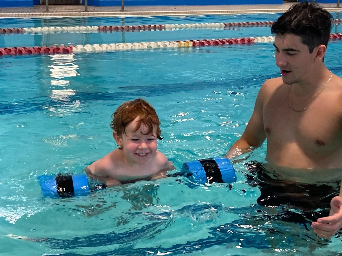 Darwin Ecker and Swim Instructor Anthony Culic.