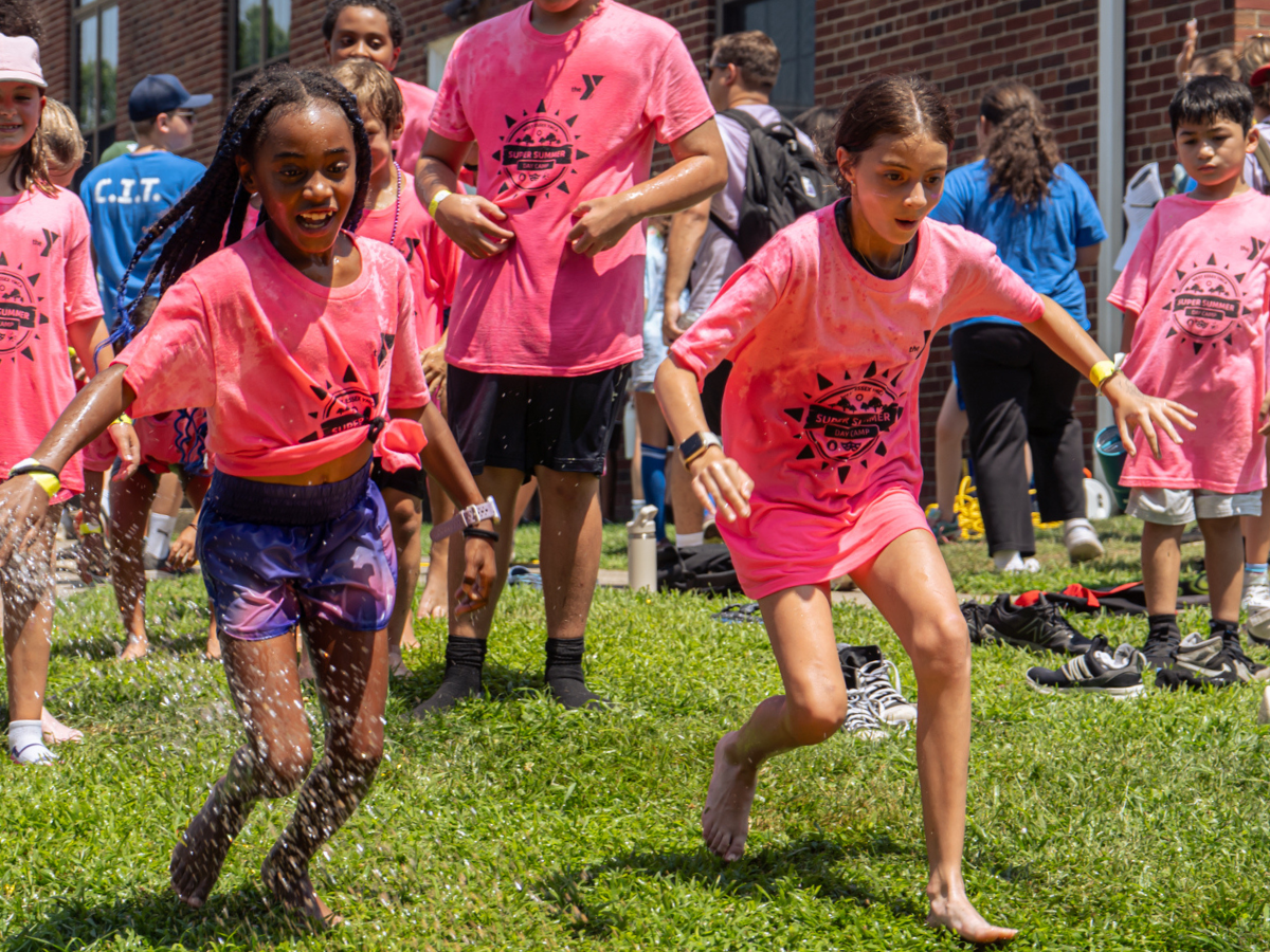 Campers enjoy field day water activities.