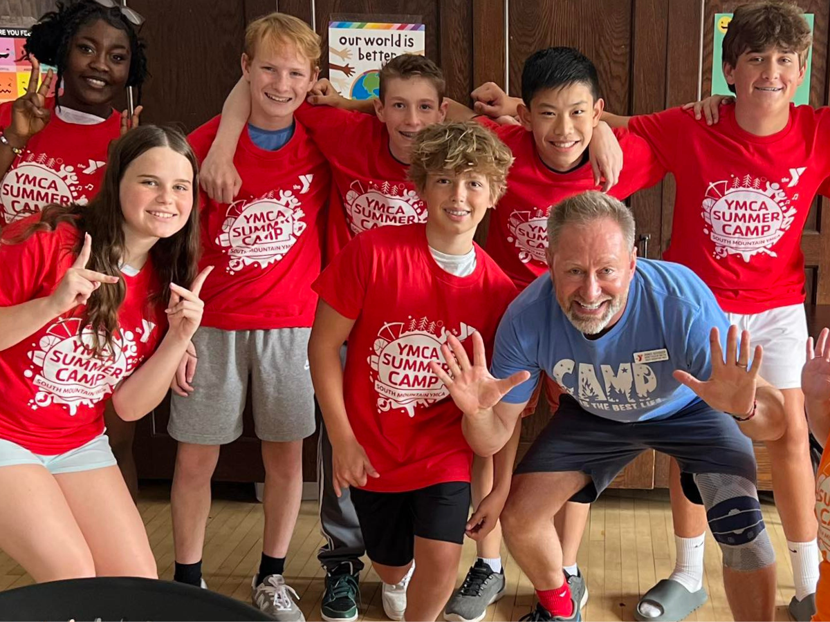 CIT campers pose for a photo with South Mountain YMCA District Executive Director James Goodger
