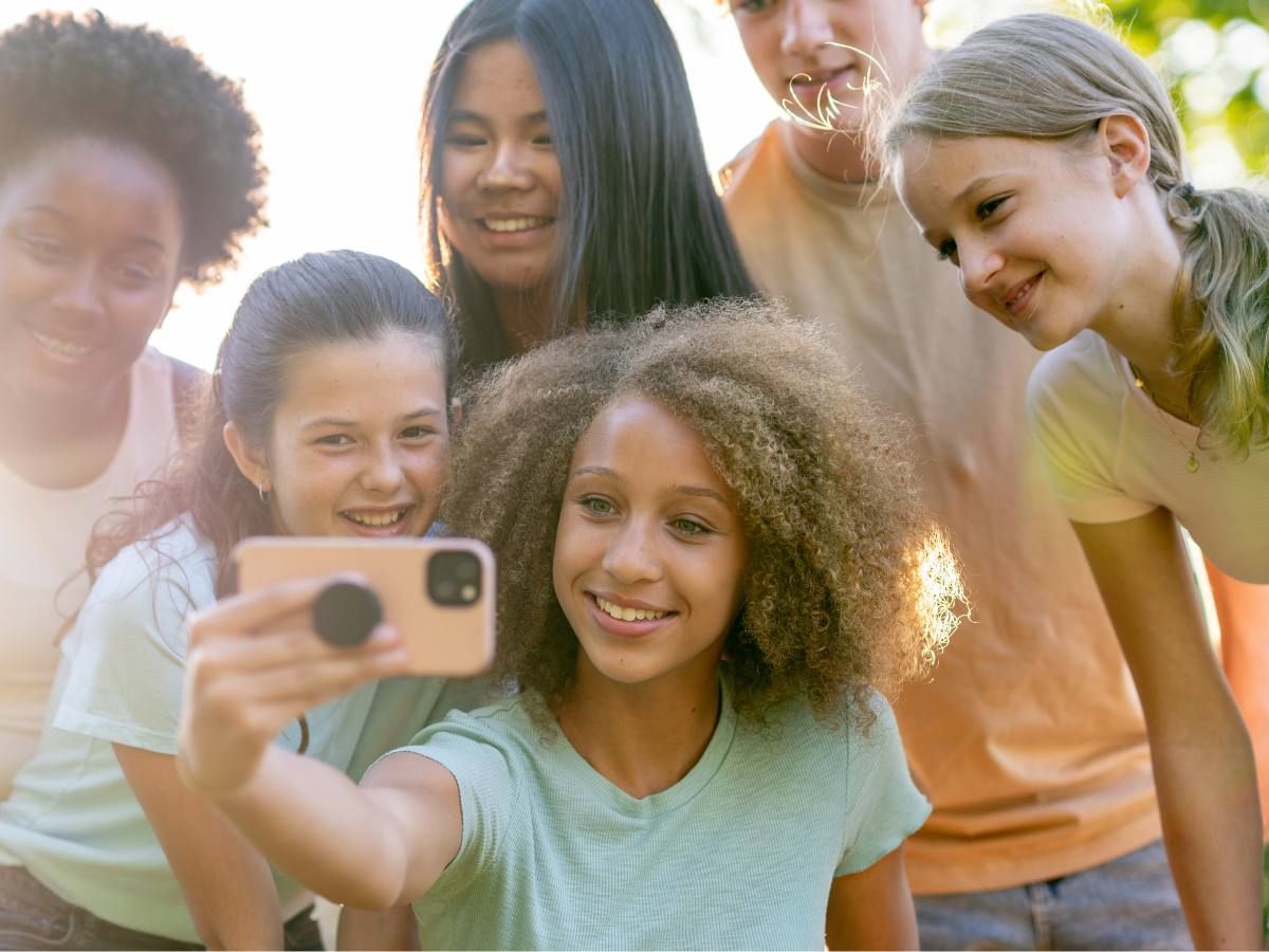 Teens taking a selfie with their phone